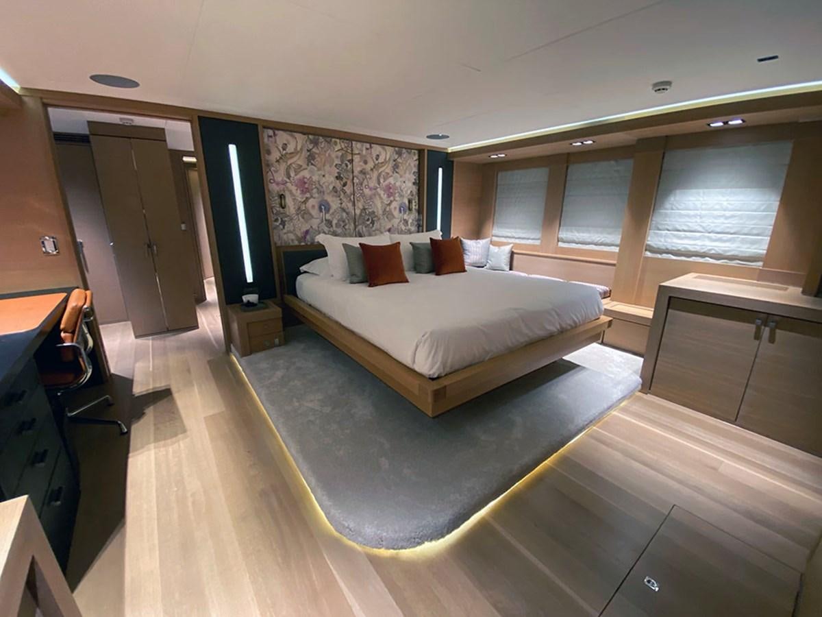 a large bedroom with a large bed aboard ESCAPE Yacht for Sale