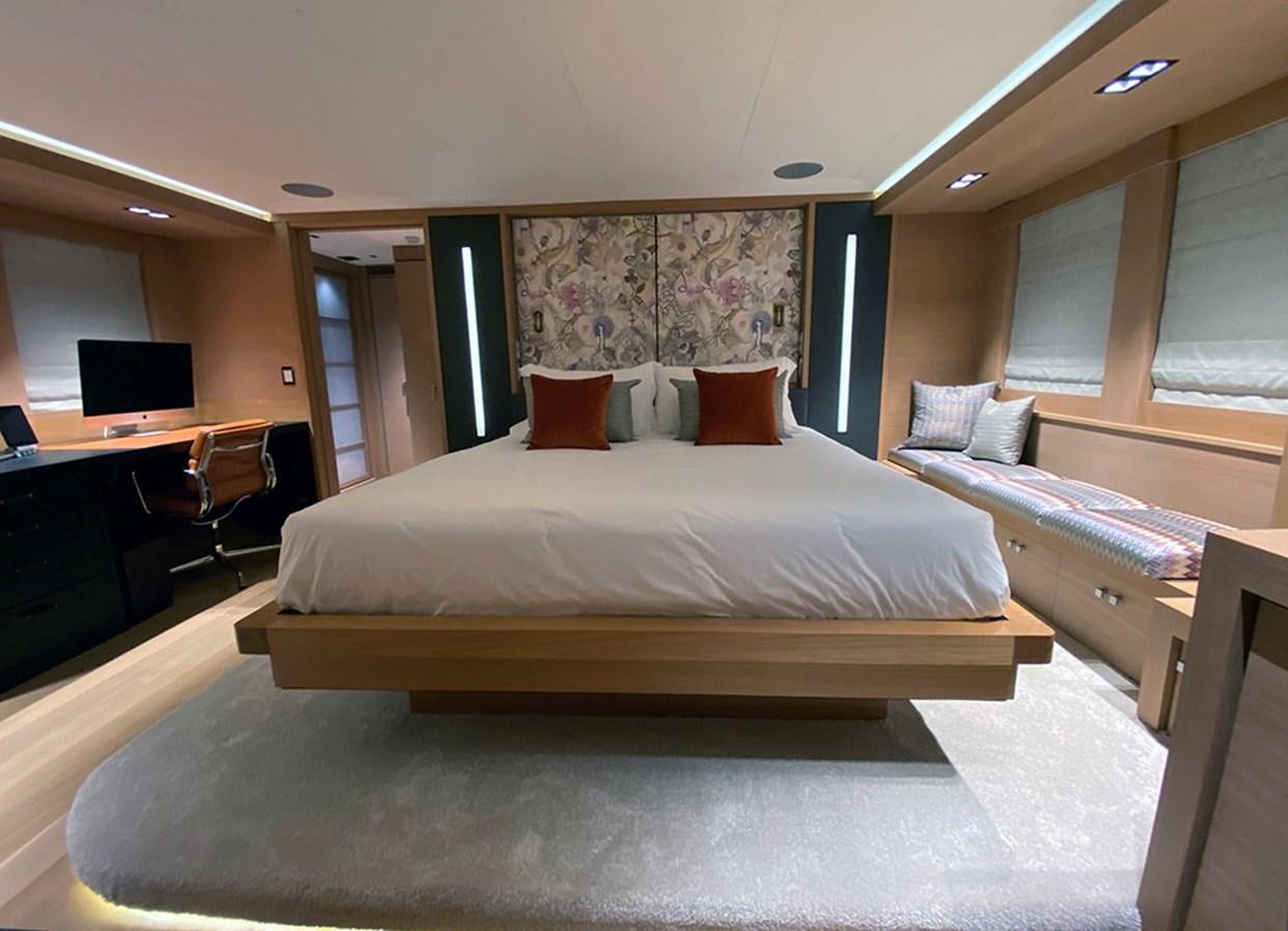 a room with a bed and a desk aboard ESCAPE Yacht for Sale
