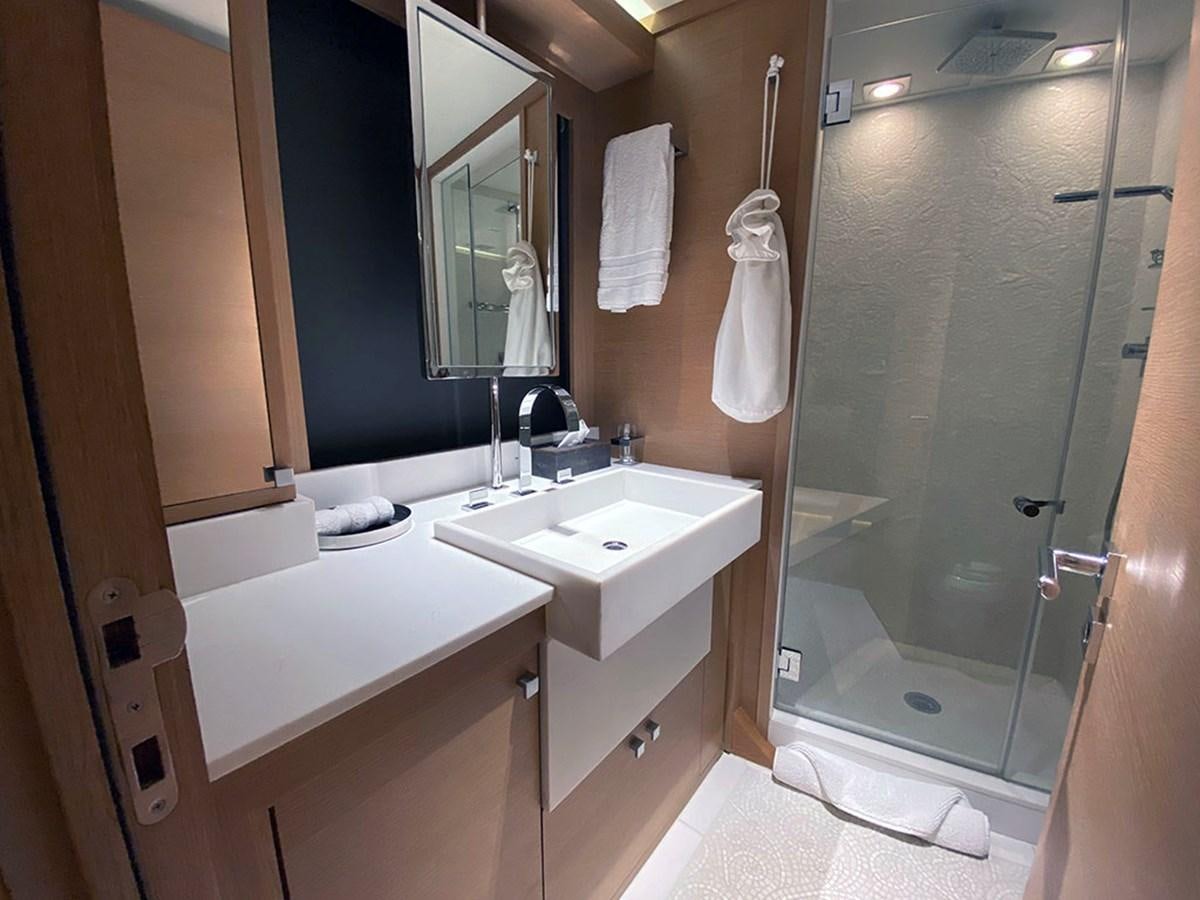 a bathroom with a large mirror aboard ESCAPE Yacht for Sale