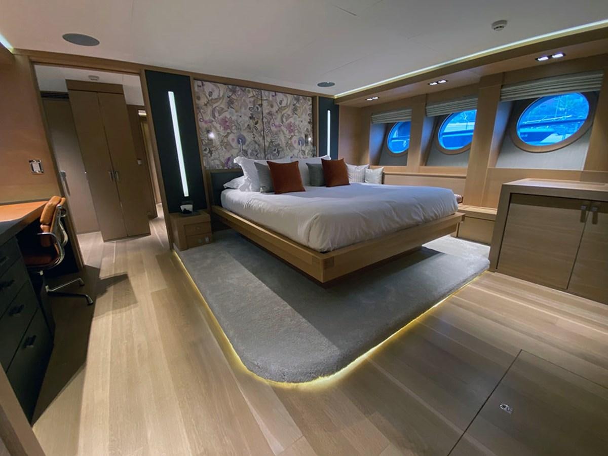 a large bedroom with a large bed aboard ESCAPE Yacht for Sale