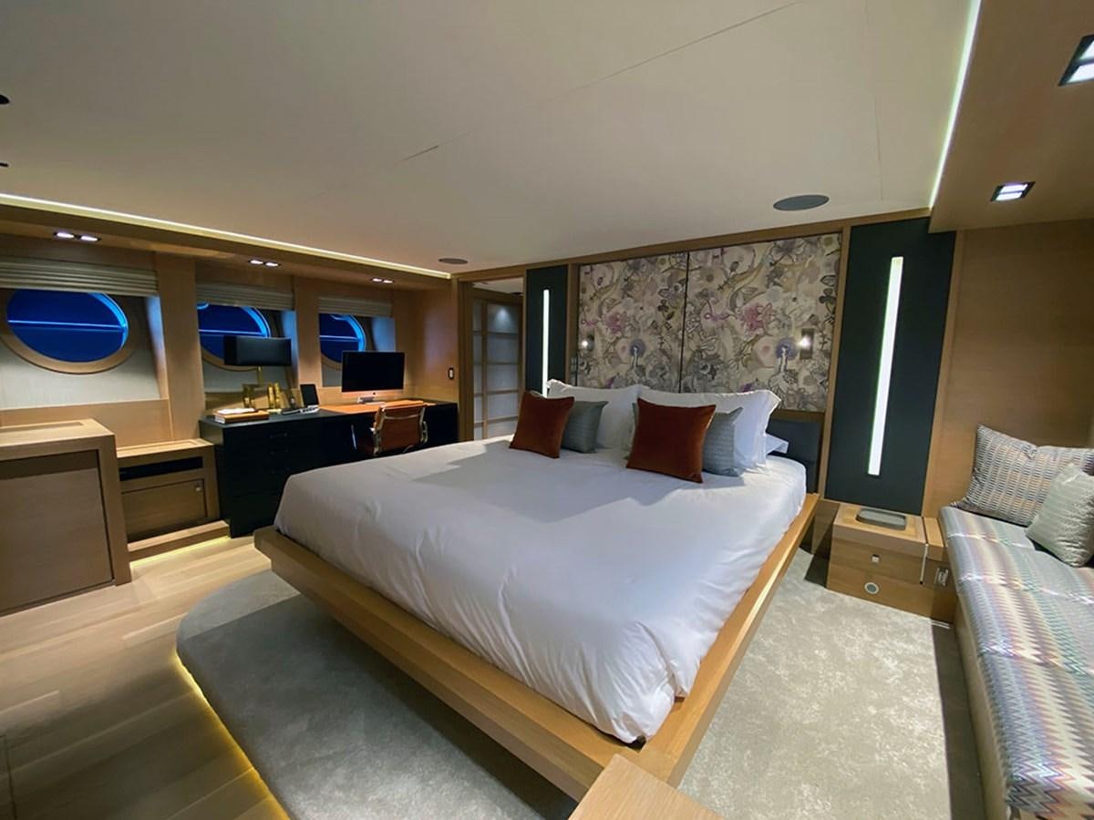 a room with a bed and a desk aboard ESCAPE Yacht for Sale