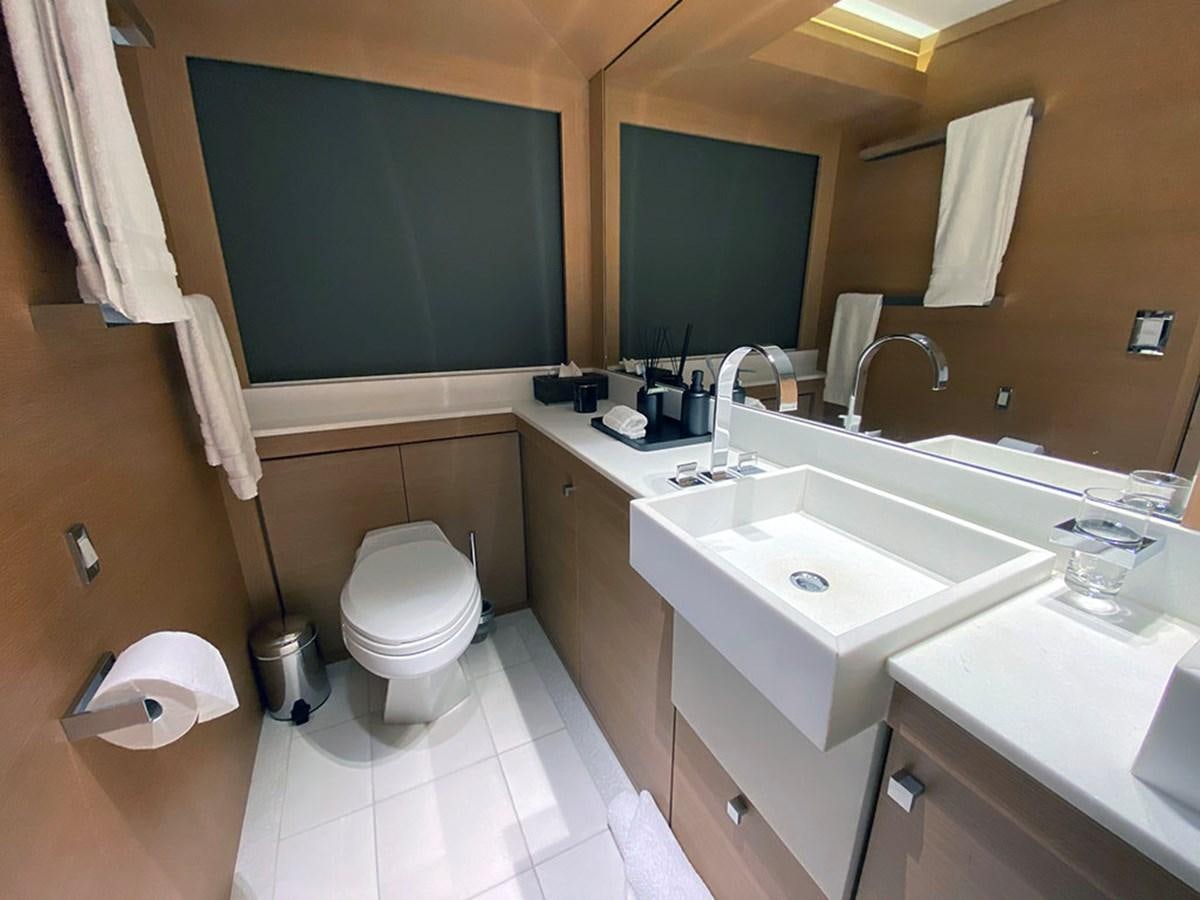 a bathroom with a sink and a toilet aboard ESCAPE Yacht for Sale