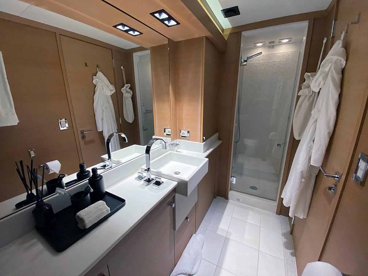 a bathroom with a large mirror aboard ESCAPE Yacht for Sale
