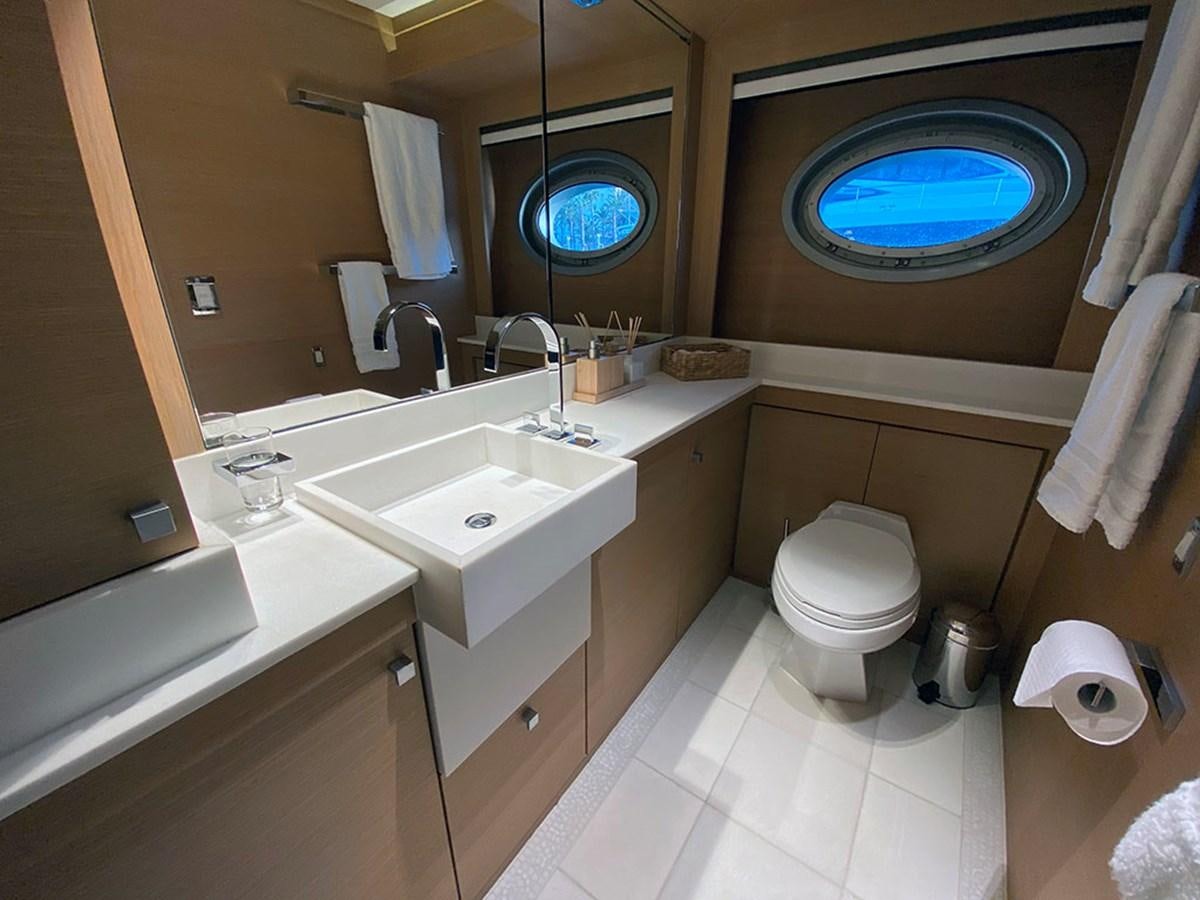 a bathroom with a large window aboard ESCAPE Yacht for Sale