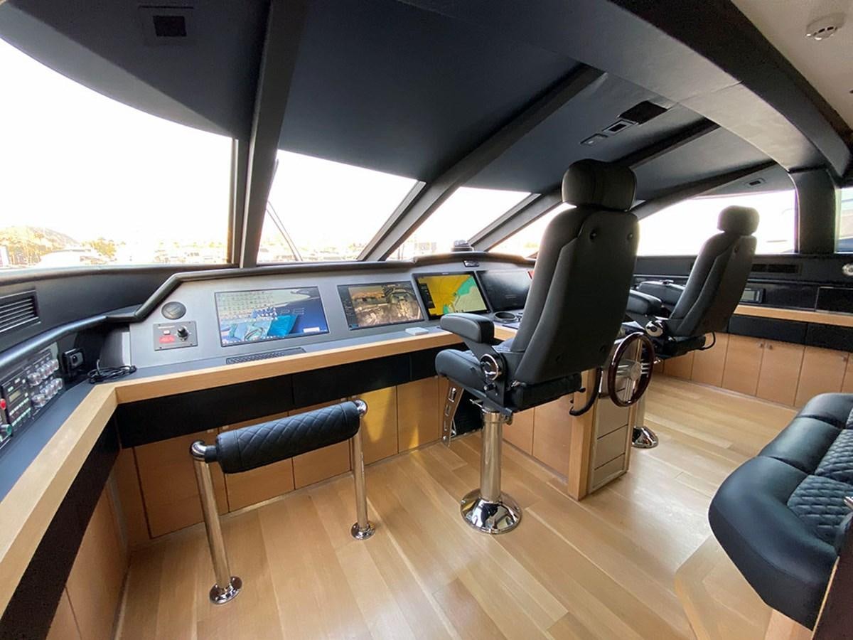 a room with a desk and chairs aboard ESCAPE Yacht for Sale