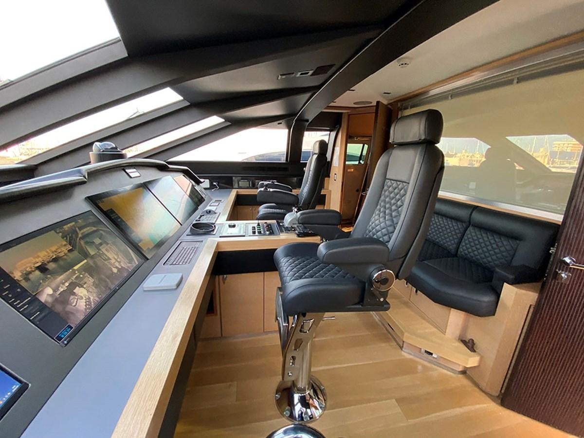 a room with a desk and chairs aboard ESCAPE Yacht for Sale