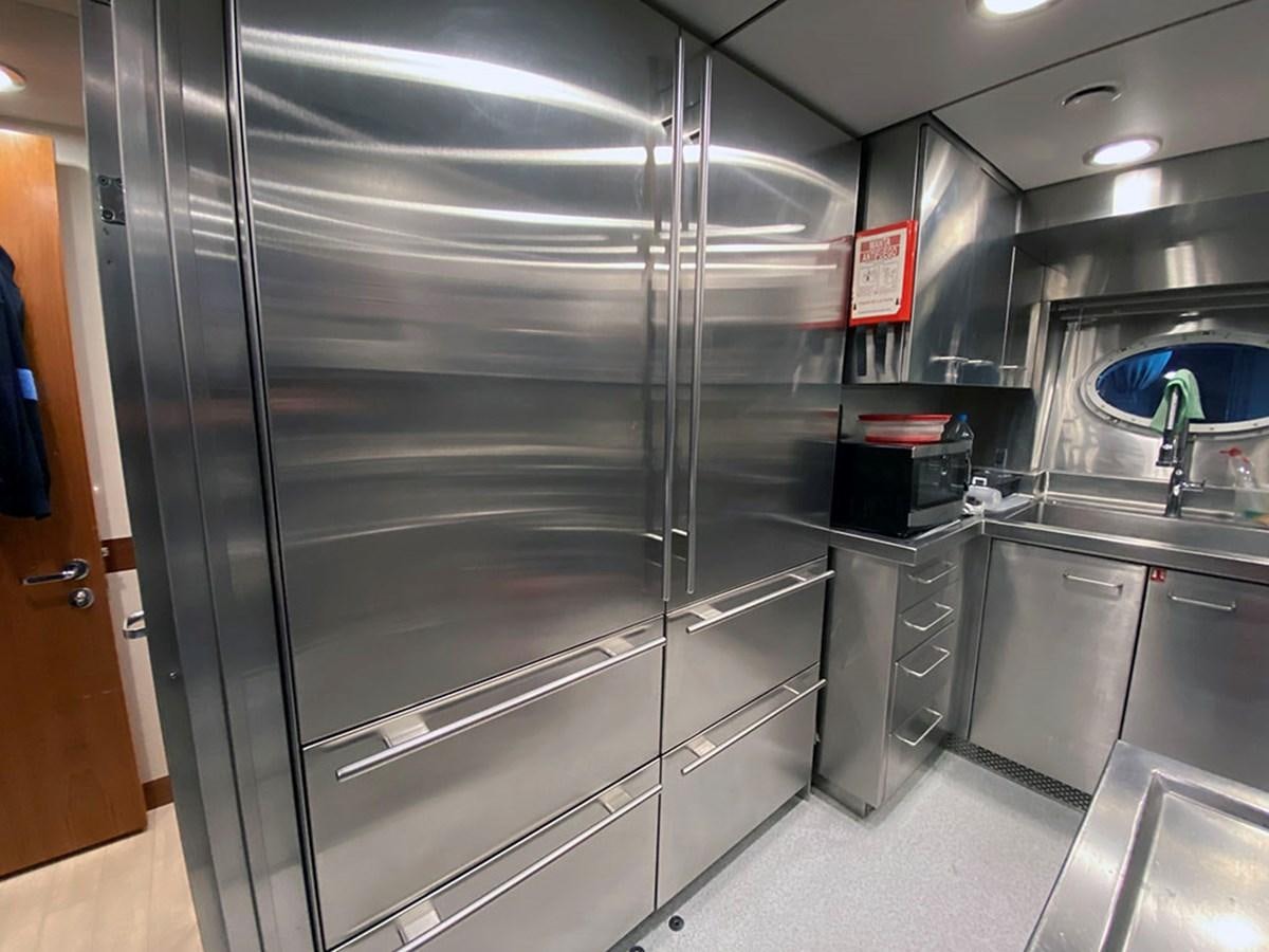 a stainless steel kitchen aboard ESCAPE Yacht for Sale