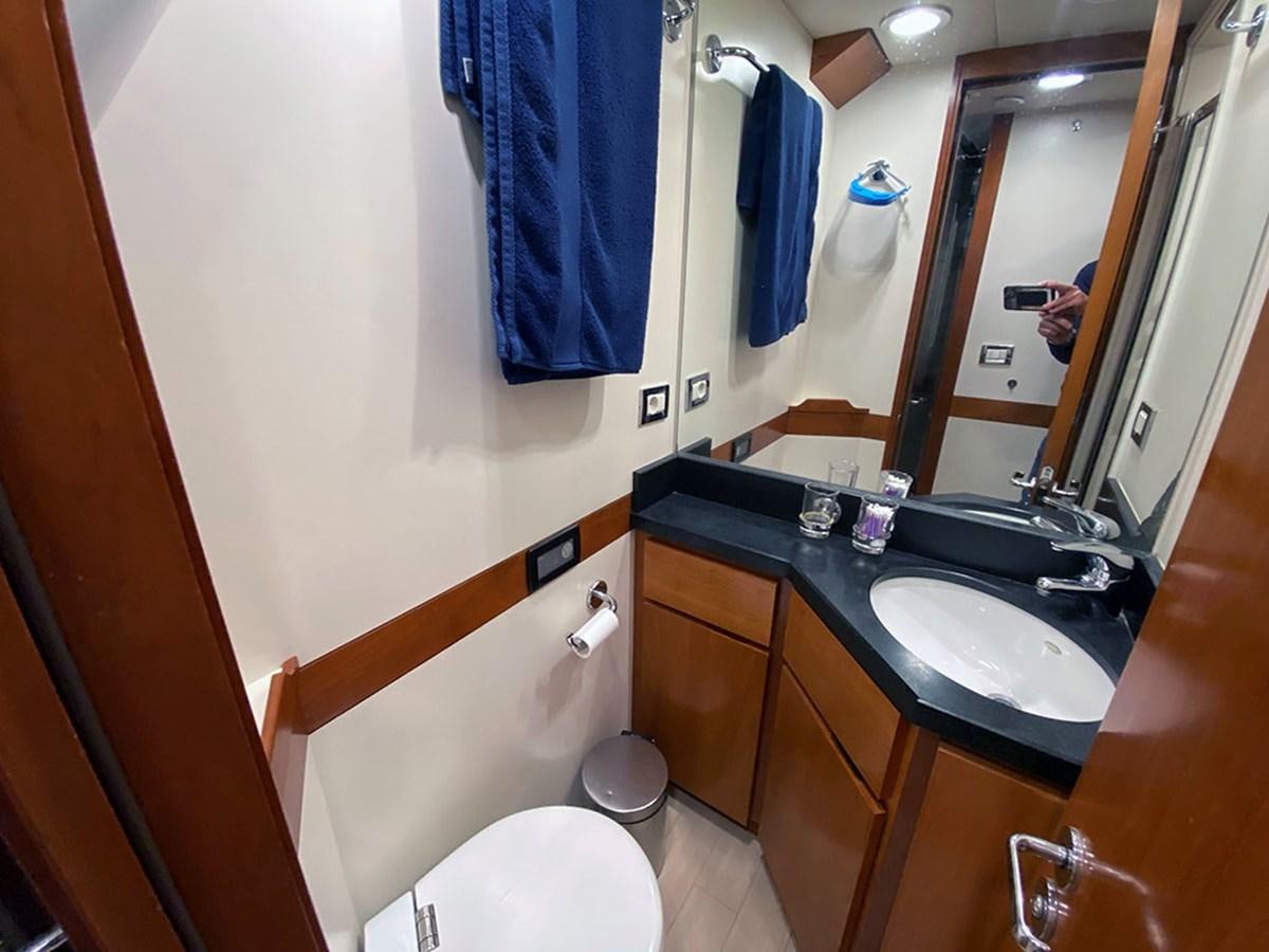 a bathroom with a sink and a toilet aboard ESCAPE Yacht for Sale
