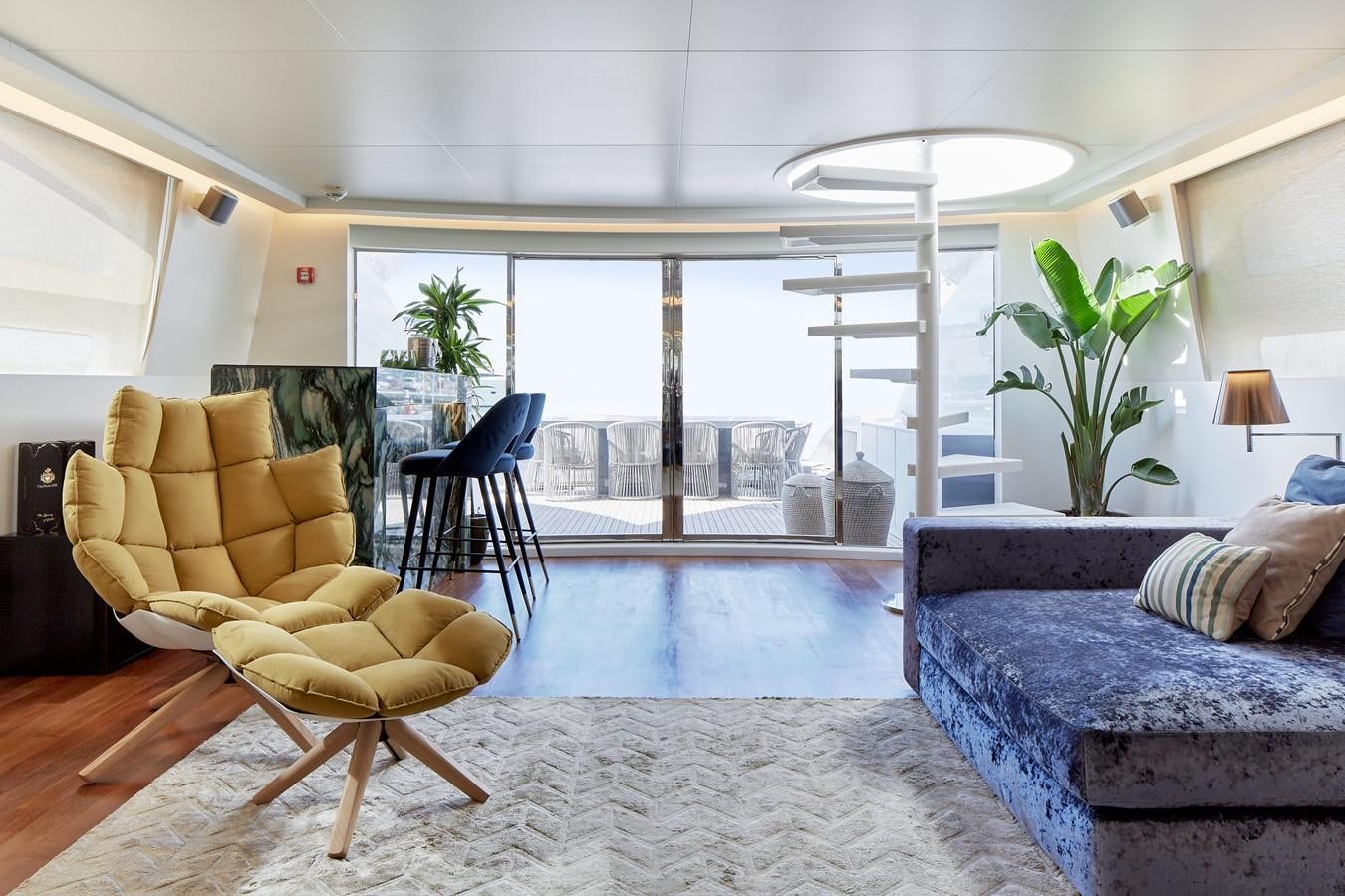 a living room with a large glass door aboard EVA Yacht for Sale