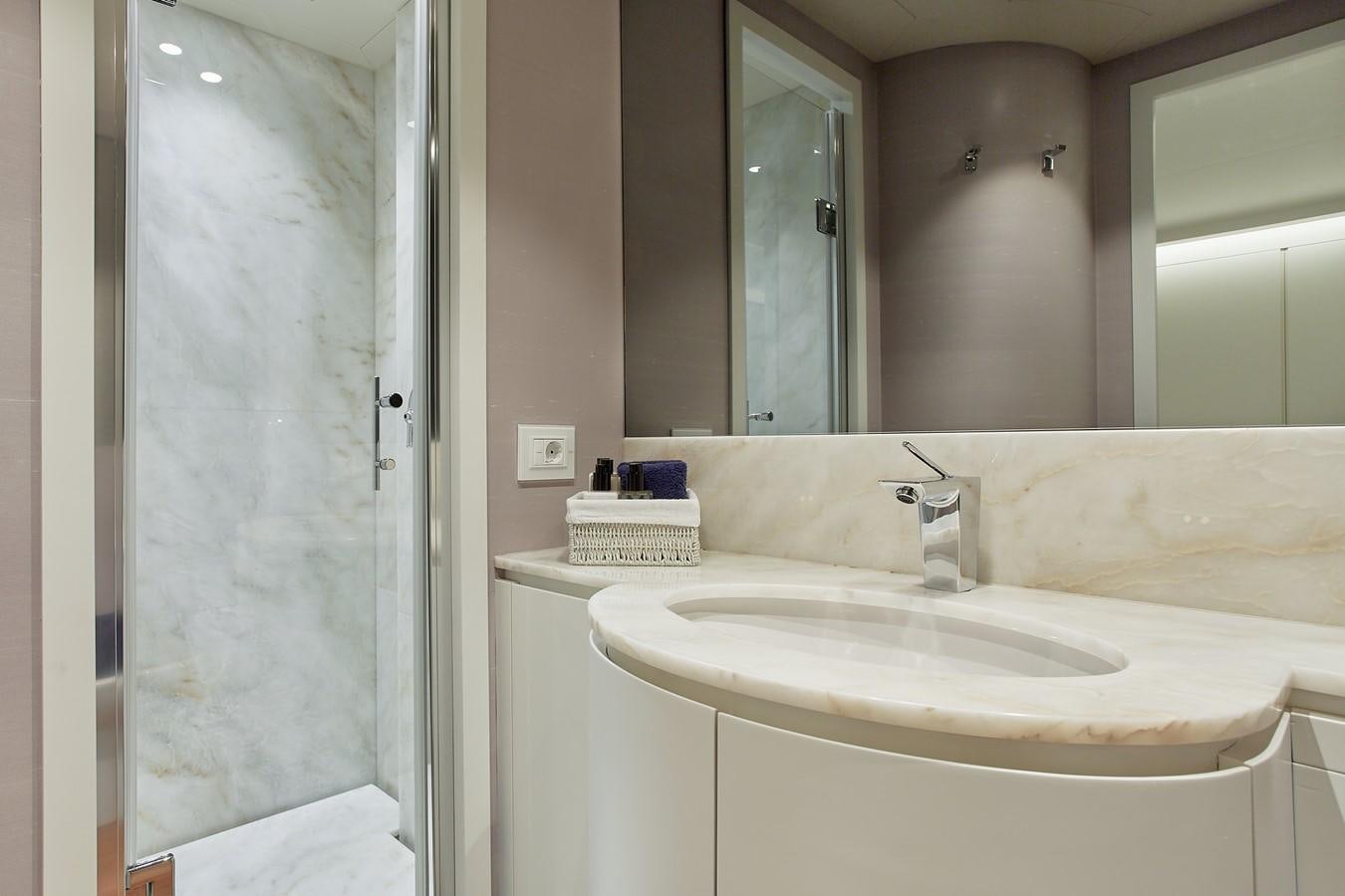 a bathroom with a sink and a shower aboard EVA Yacht for Sale