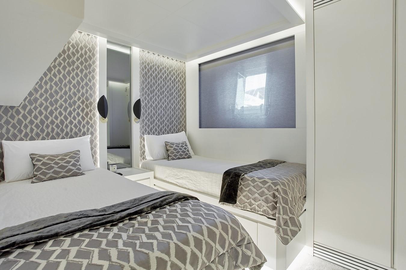 a couple of beds in a room aboard EVA Yacht for Sale