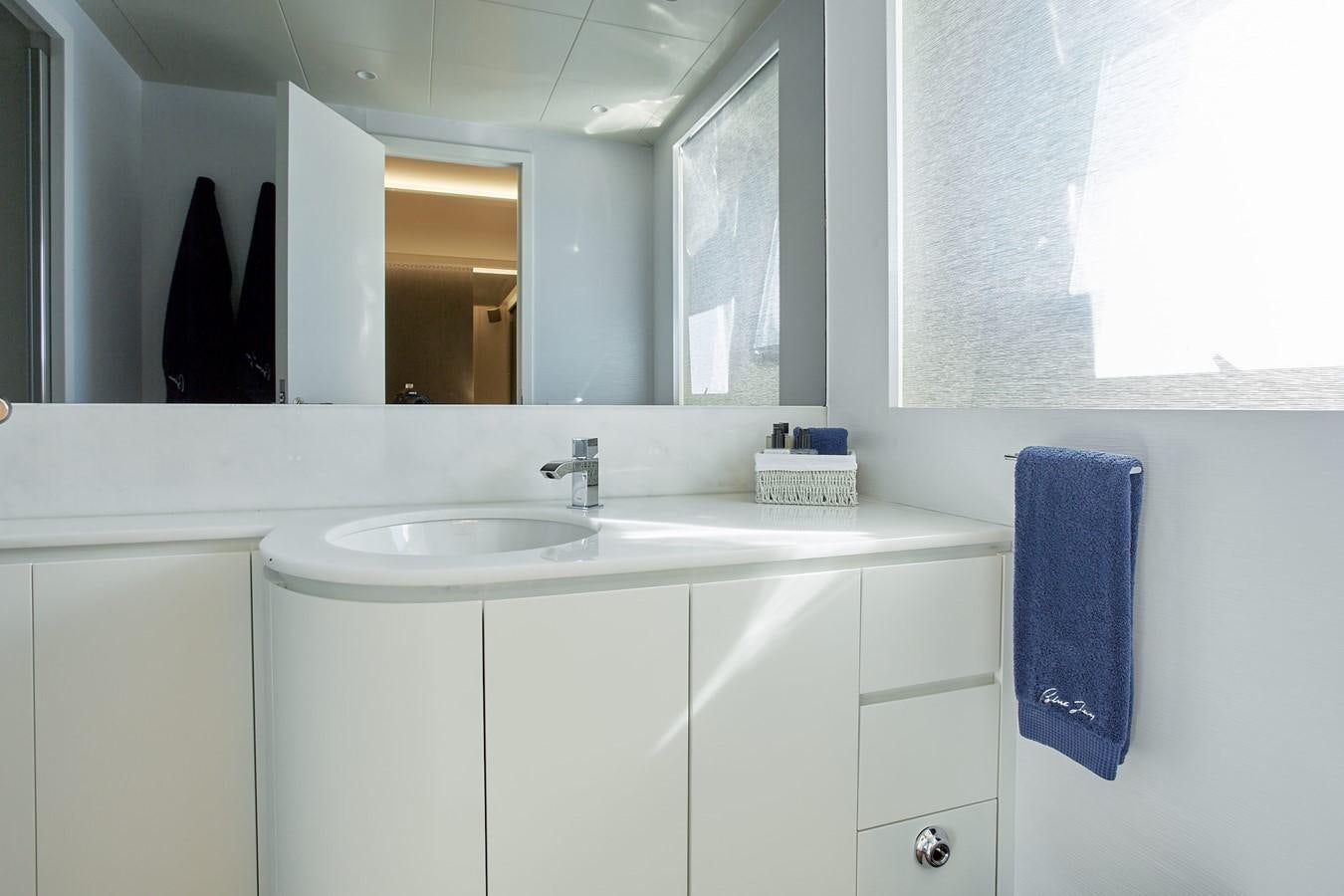 a bathroom with a sink and a mirror aboard EVA Yacht for Sale