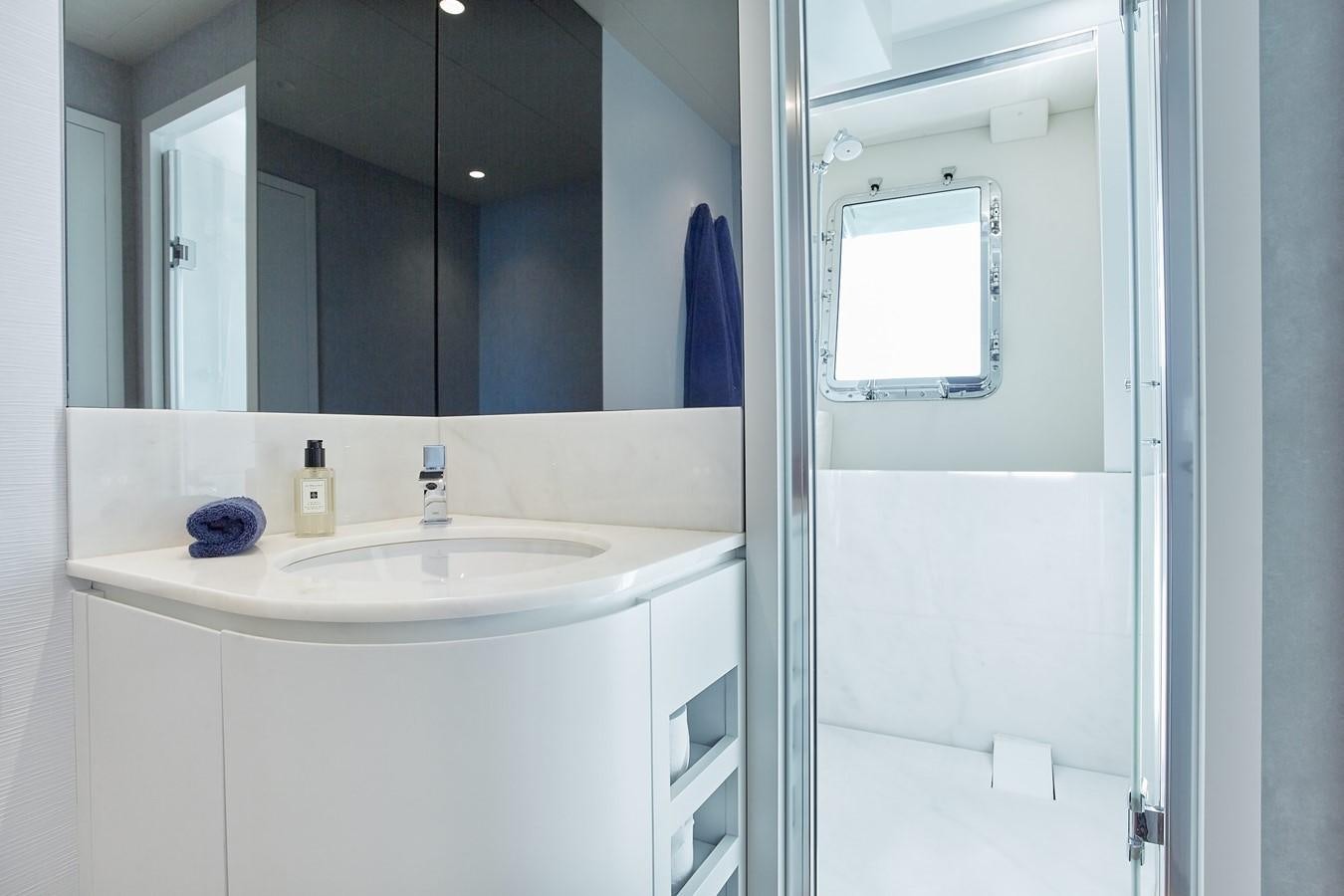 a bathroom with a sink and a mirror aboard EVA Yacht for Sale