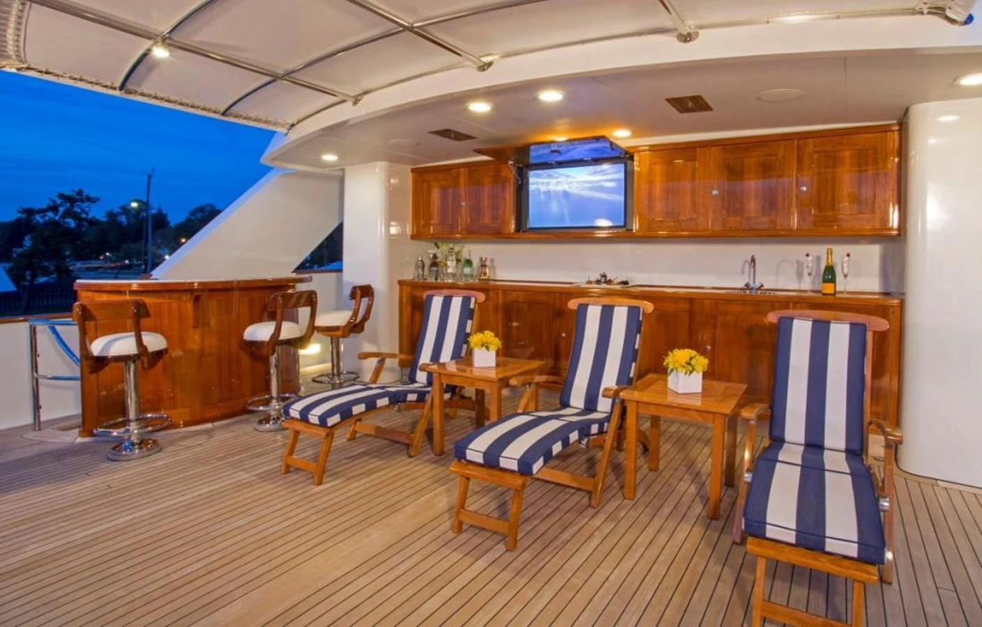 a kitchen with a dining table and chairs aboard LADY VICTORIA Yacht for Sale