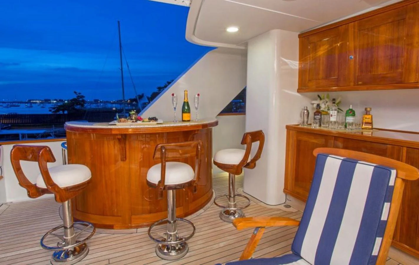 a room with a table chairs and a window aboard LADY VICTORIA Yacht for Sale