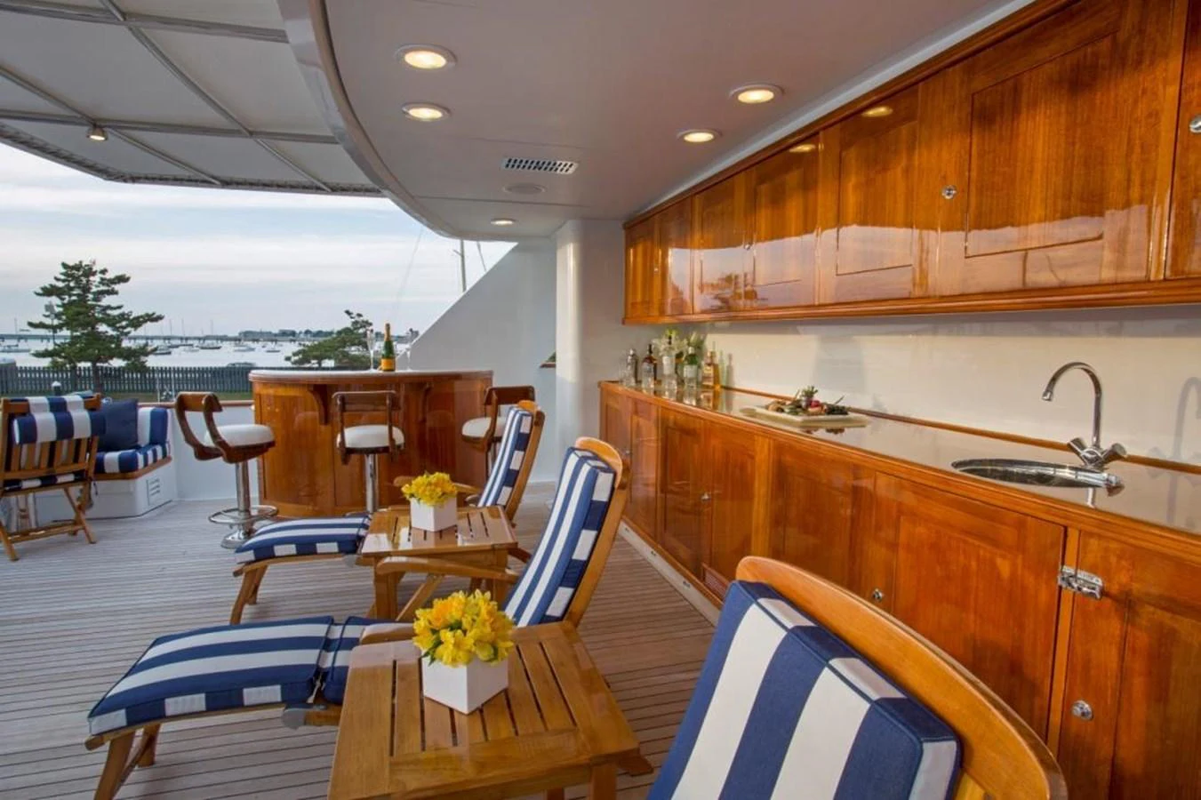 a kitchen with a table and chairs aboard LADY VICTORIA Yacht for Sale