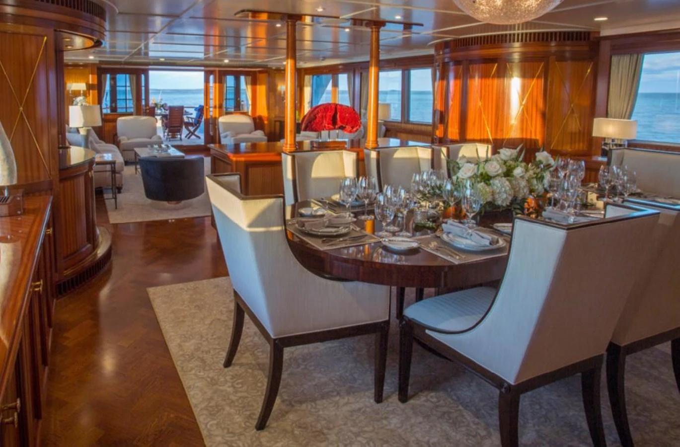 a large dining room with a large table and chairs aboard LADY VICTORIA Yacht for Sale