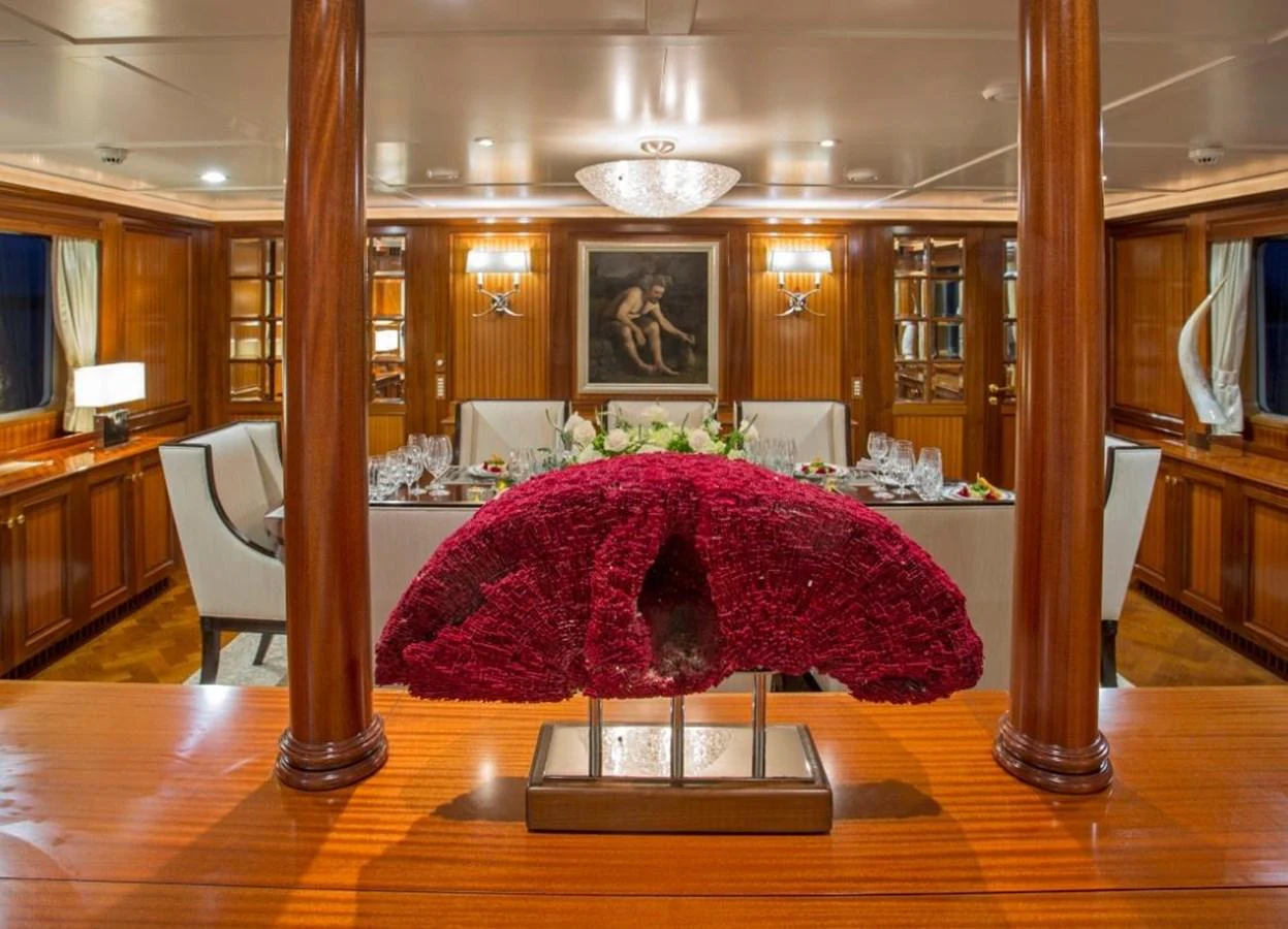 a large room with a table and chairs aboard LADY VICTORIA Yacht for Sale