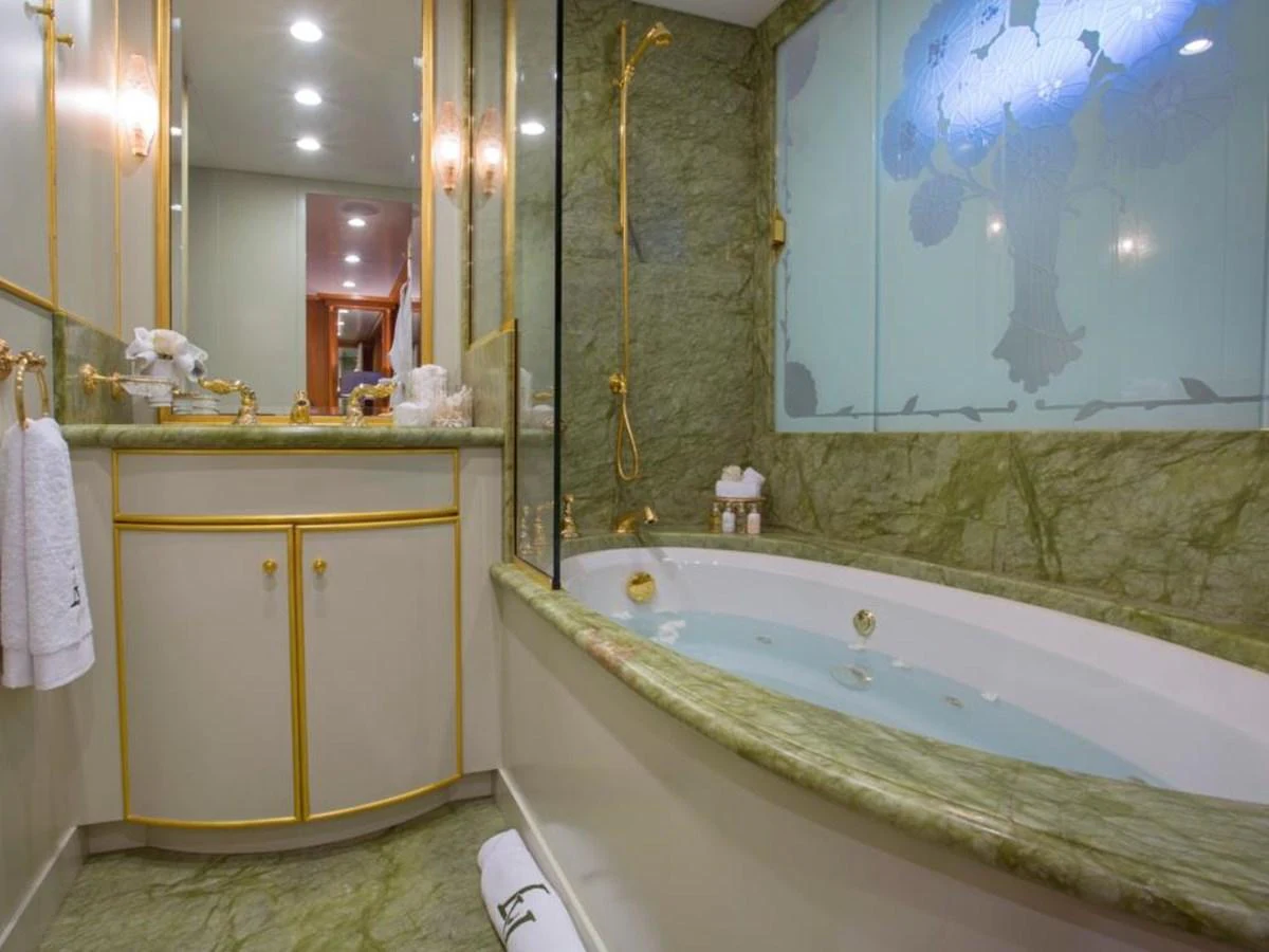 a bathroom with a tub and sink aboard LADY VICTORIA Yacht for Sale