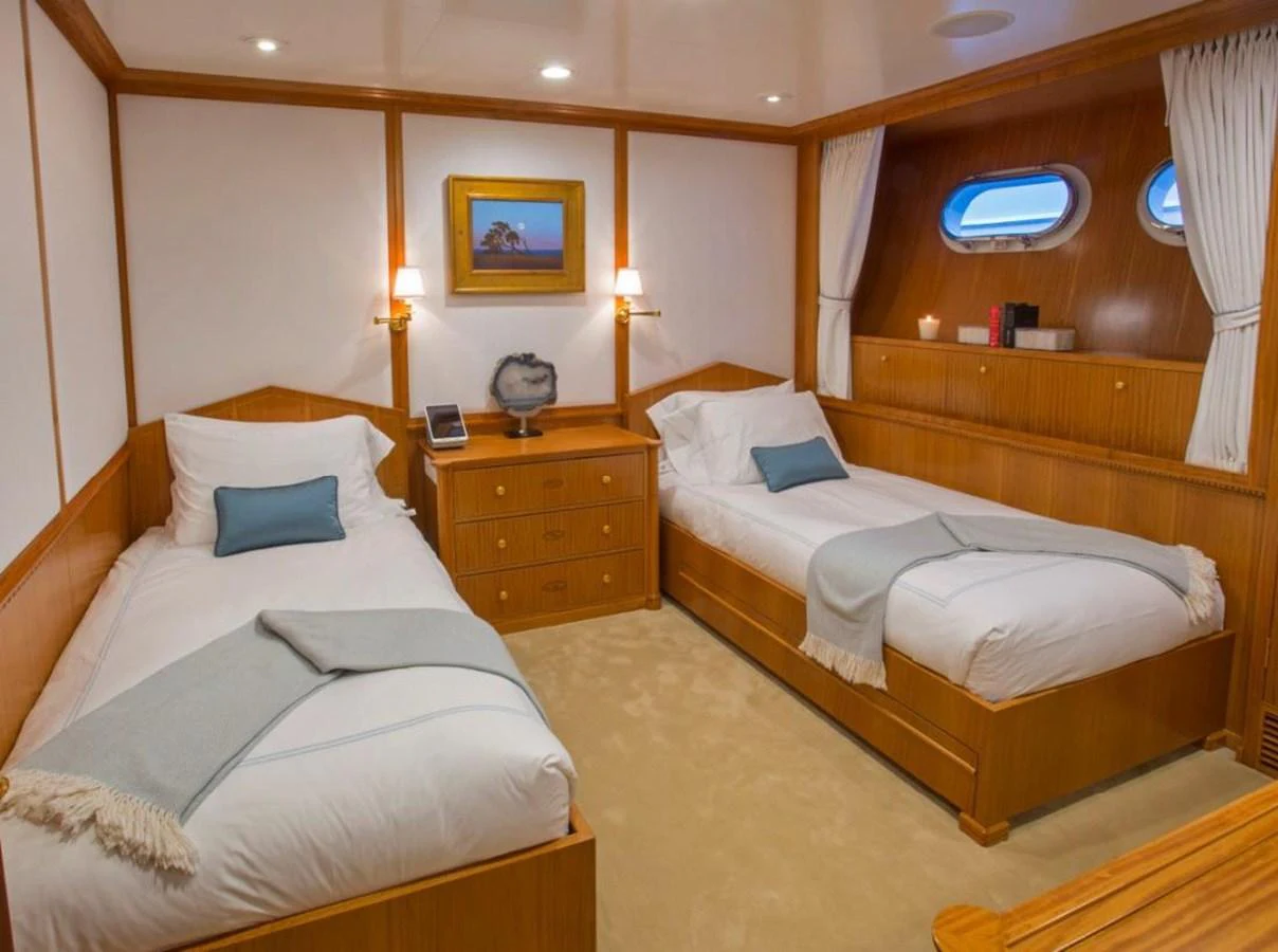 a room with two beds aboard LADY VICTORIA Yacht for Sale