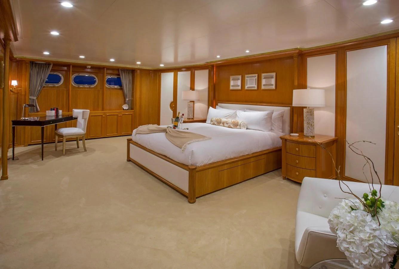 a hotel room with a bed and a table aboard LADY VICTORIA Yacht for Sale