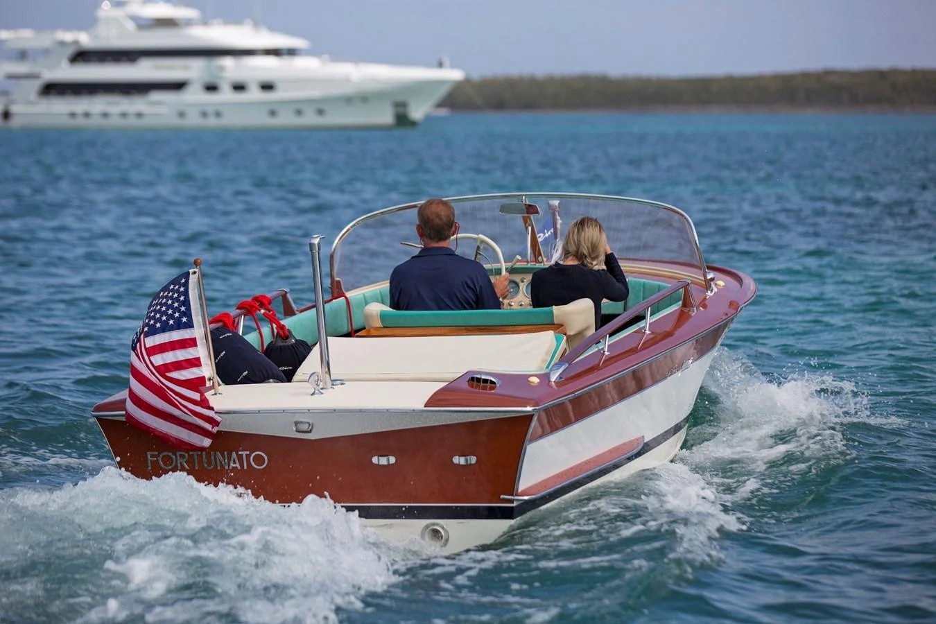 a boat with a flag on it aboard LADY VICTORIA Yacht for Sale