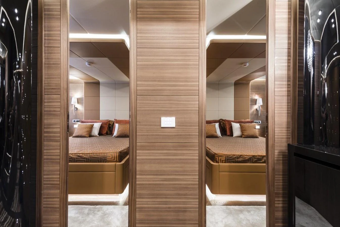 a room with a bed and a mirror aboard HARMONY Yacht for Sale