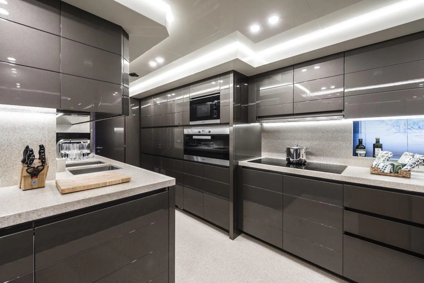 a kitchen with a large island aboard HARMONY Yacht for Sale