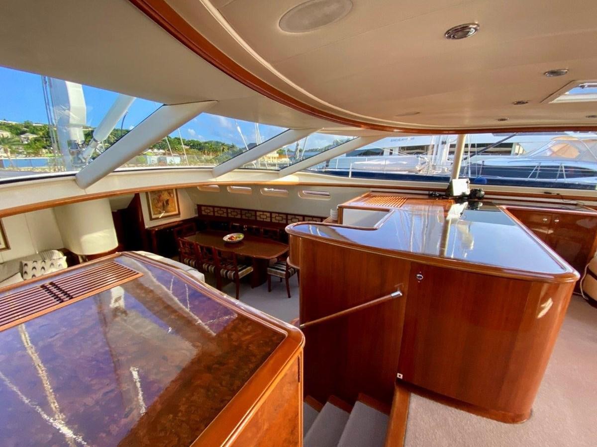 a room with a table and chairs aboard MISS SILVER Yacht for Sale