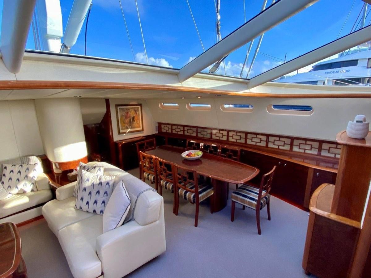 a room with a couch and a table and chairs aboard MISS SILVER Yacht for Sale