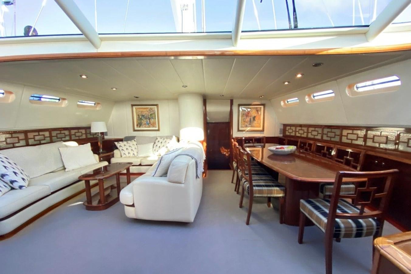 a room with a couch and a table and chairs aboard MISS SILVER Yacht for Sale