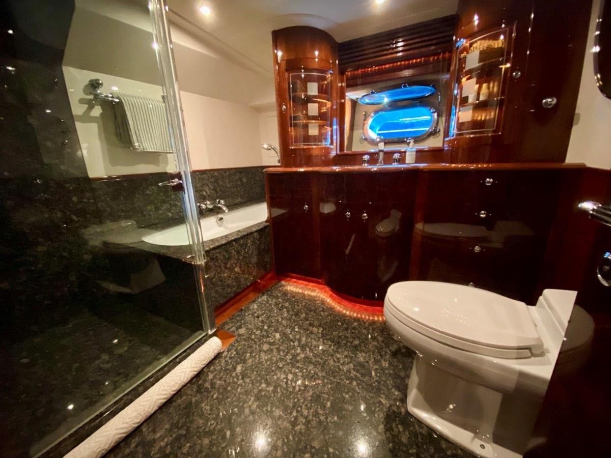 a bathroom with a glass shower aboard MISS SILVER Yacht for Sale