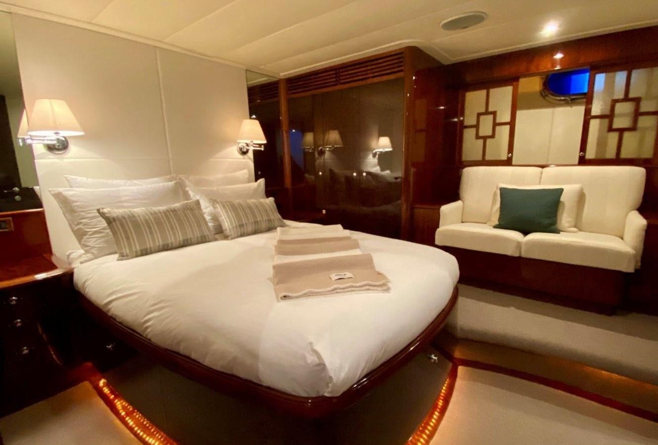 a bed with white sheets and pillows aboard MISS SILVER Yacht for Sale