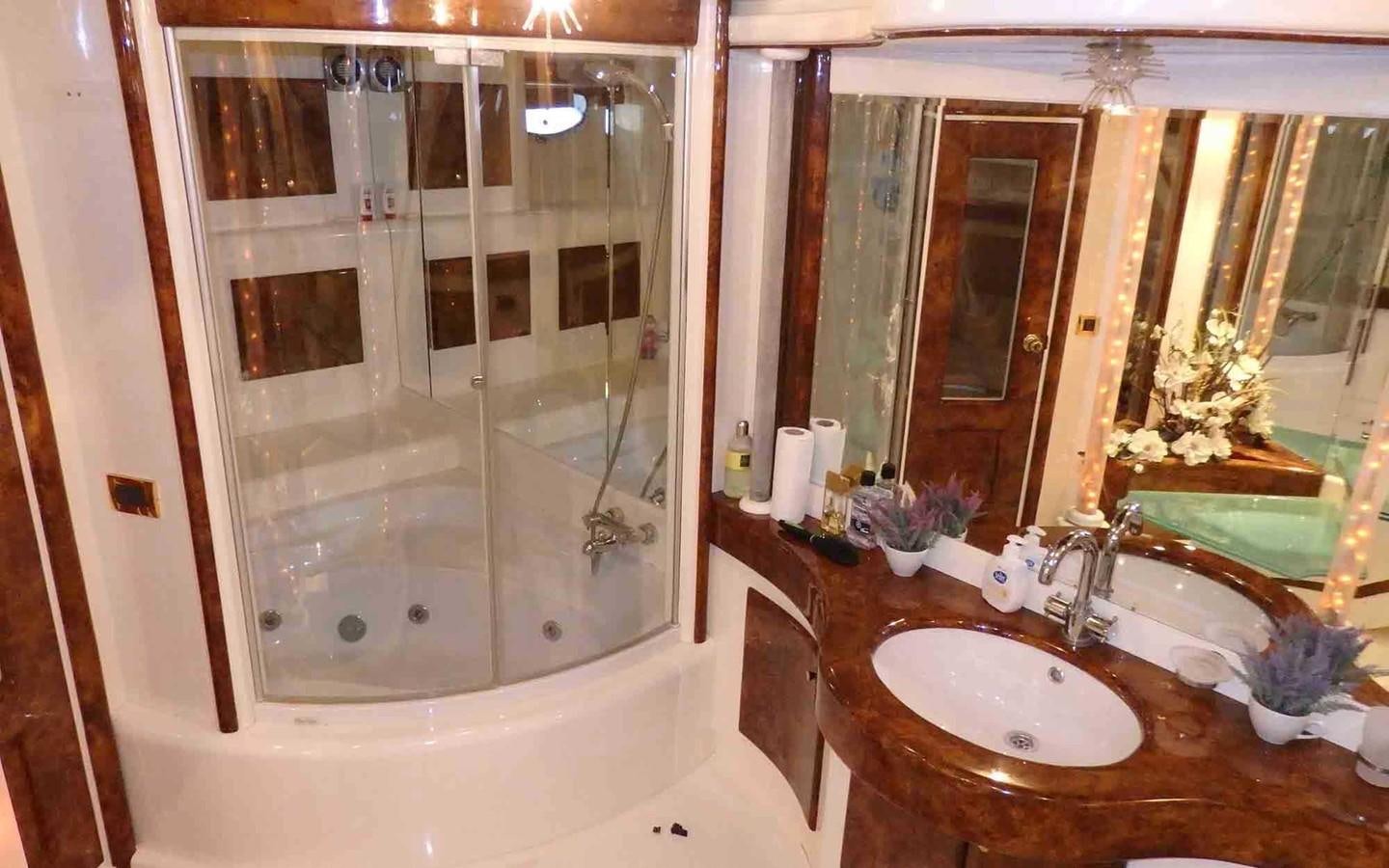 a bathroom with a large shower aboard ETERNITY Yacht for Sale