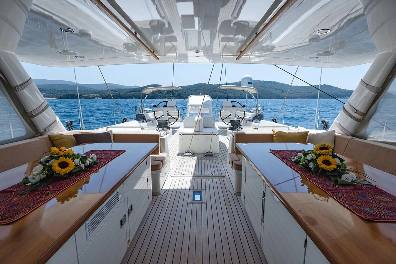 a table with flowers on it aboard PATH Yacht for Sale