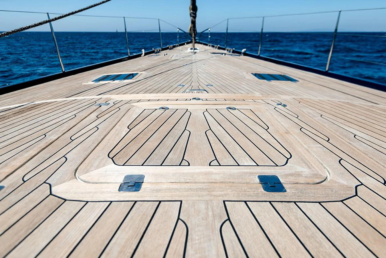 a wooden dock on a beach aboard PATH Yacht for Sale