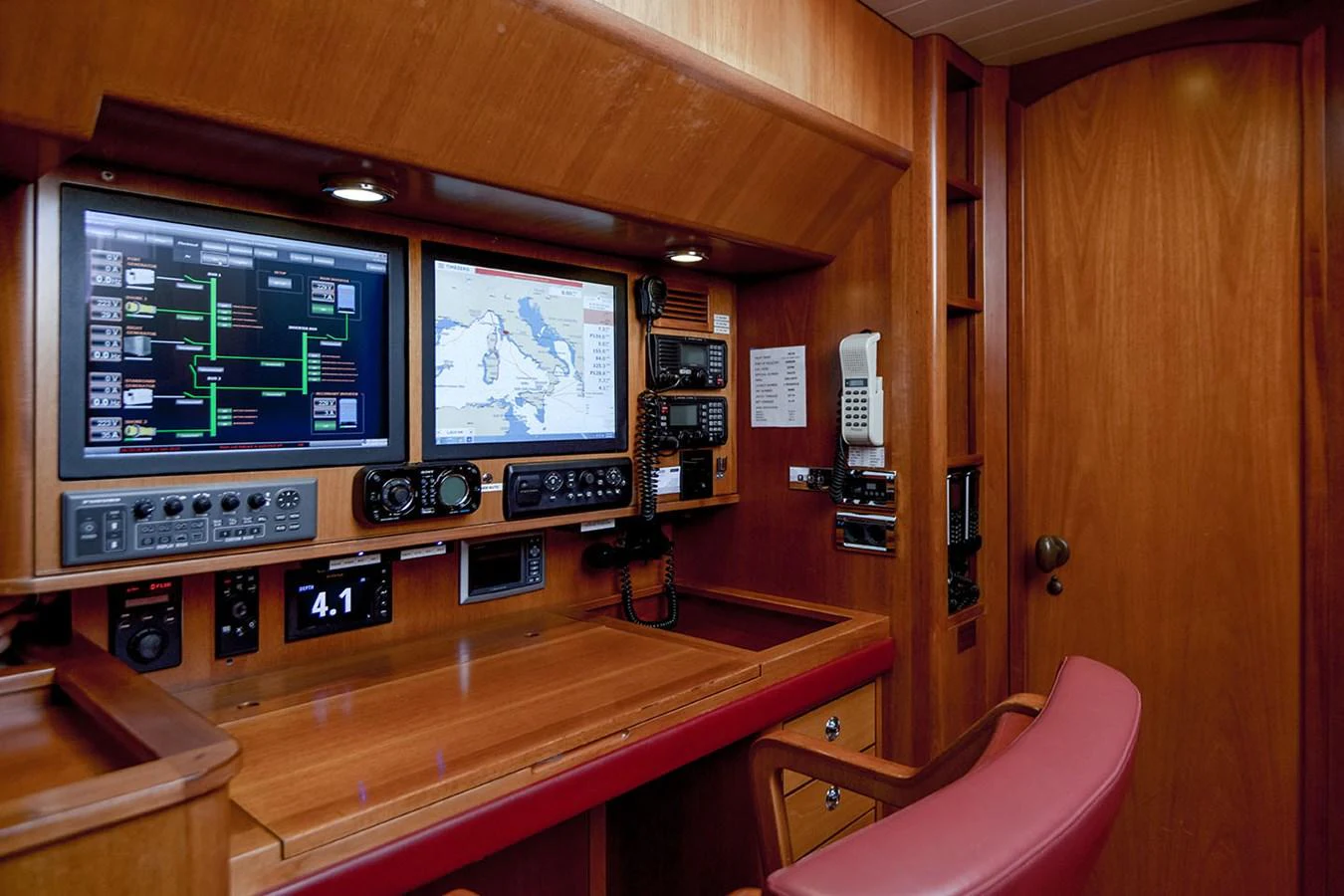 a room with a television and a chair aboard PATH Yacht for Sale