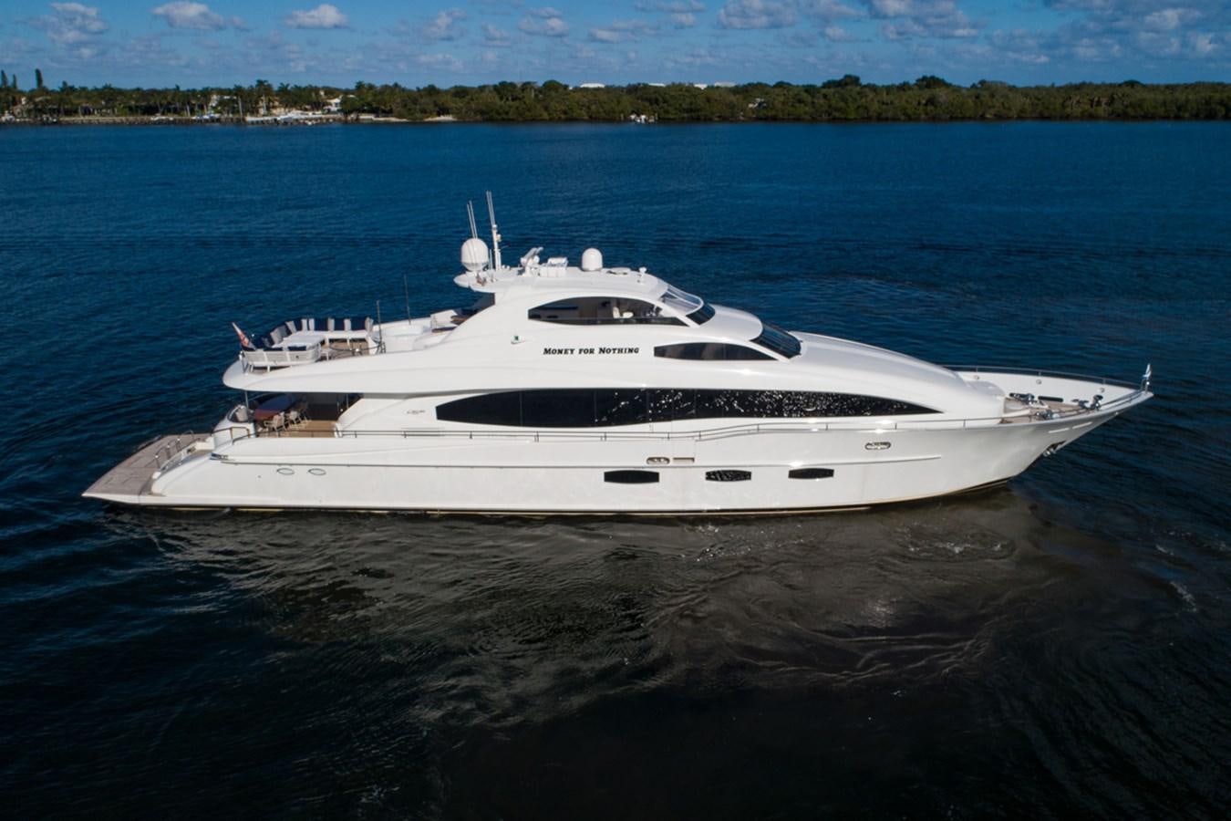 a white yacht in the water aboard MONEY FOR NOTHING Yacht for Sale