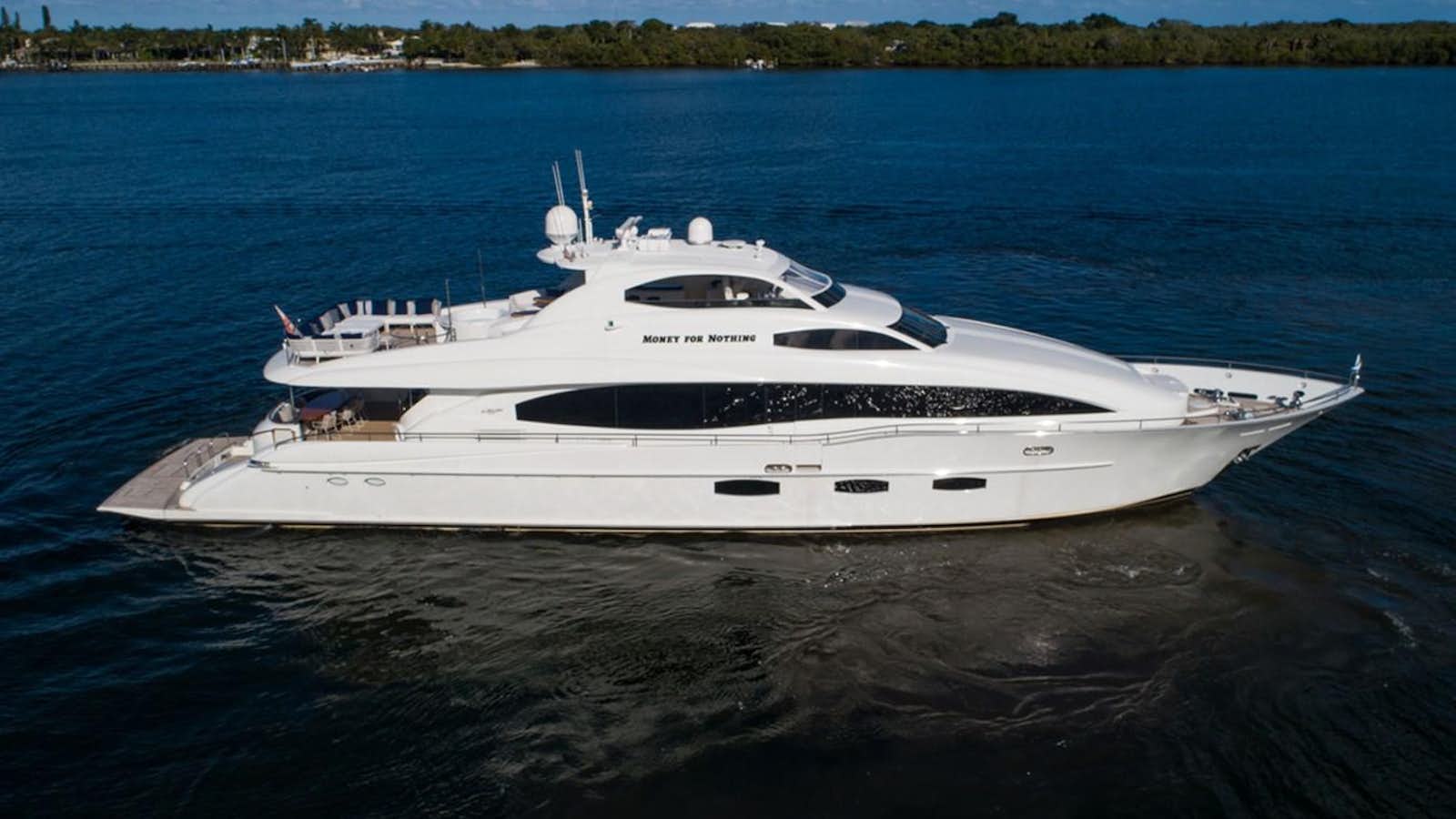 a white yacht in the water aboard MONEY FOR NOTHING Yacht for Sale
