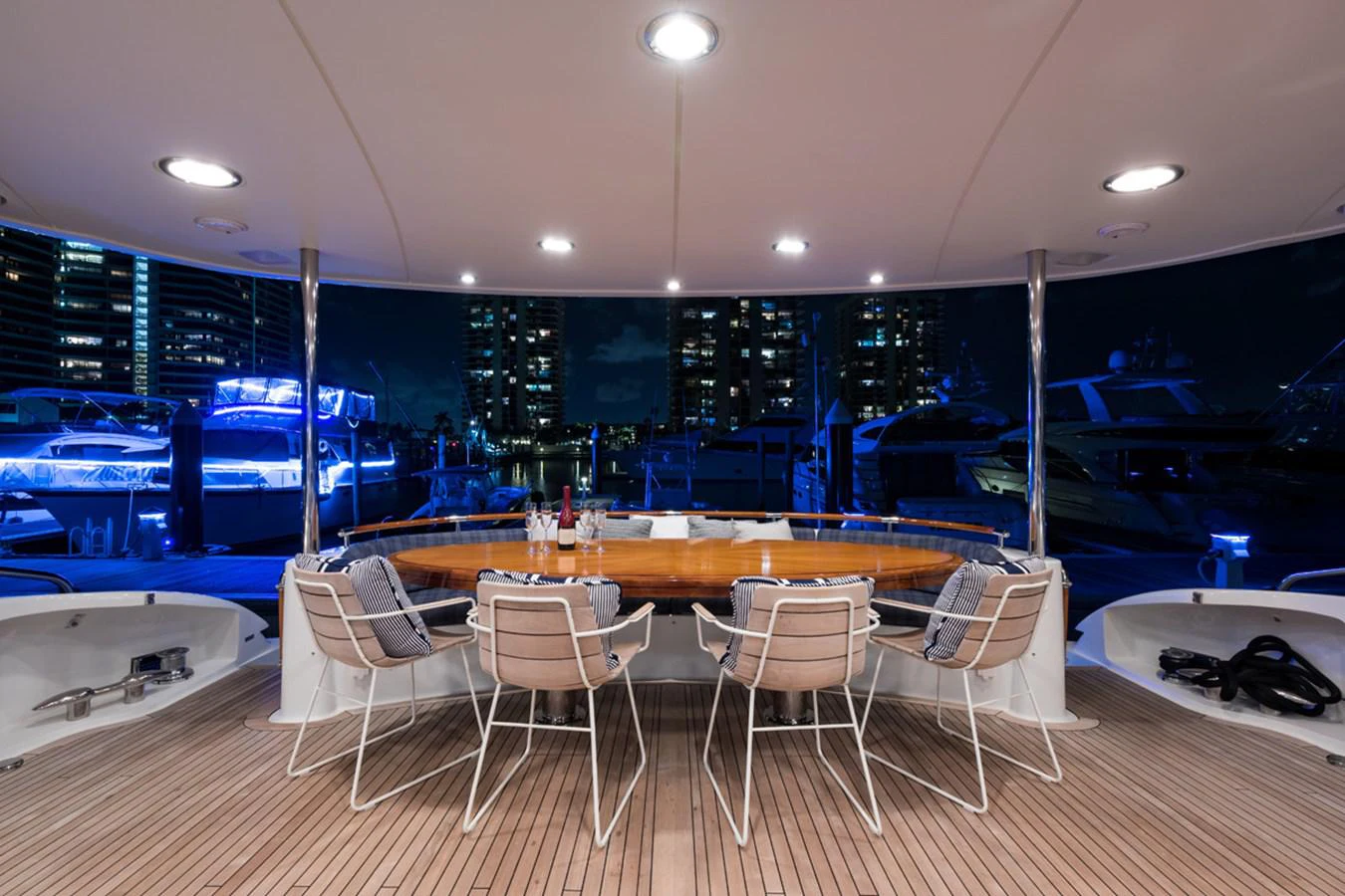 a room with tables and chairs aboard MONEY FOR NOTHING Yacht for Sale