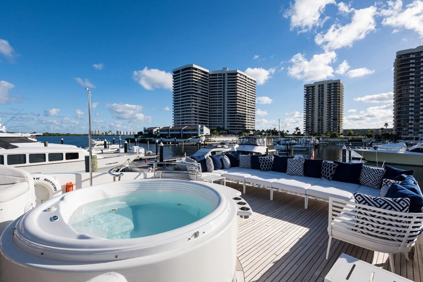 a pool with a city in the background aboard MONEY FOR NOTHING Yacht for Sale