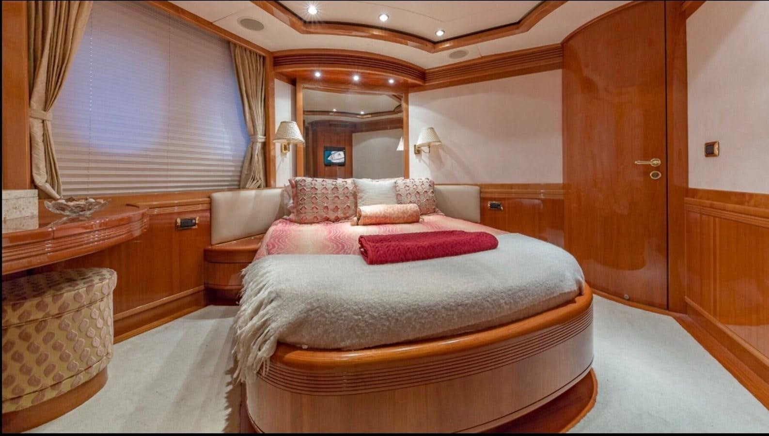 a large bedroom with a large bed aboard AVA Yacht for Sale