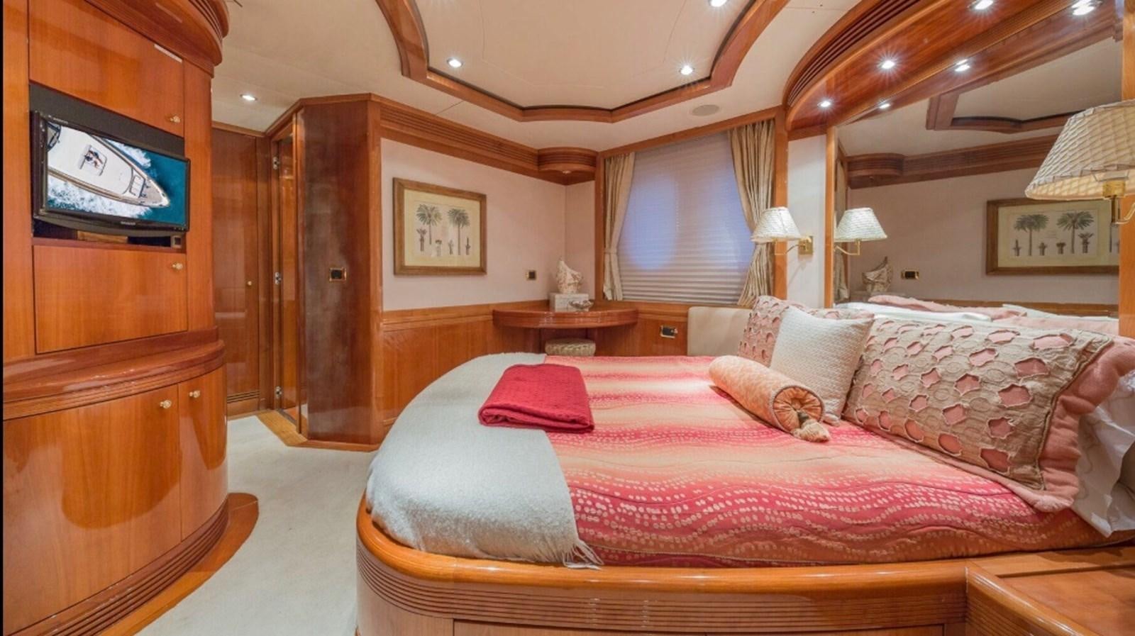 a large bed in a room aboard AVA Yacht for Sale