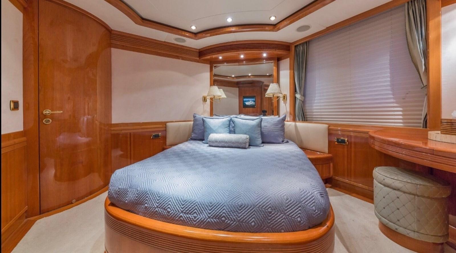 a large bed in a room aboard AVA Yacht for Sale