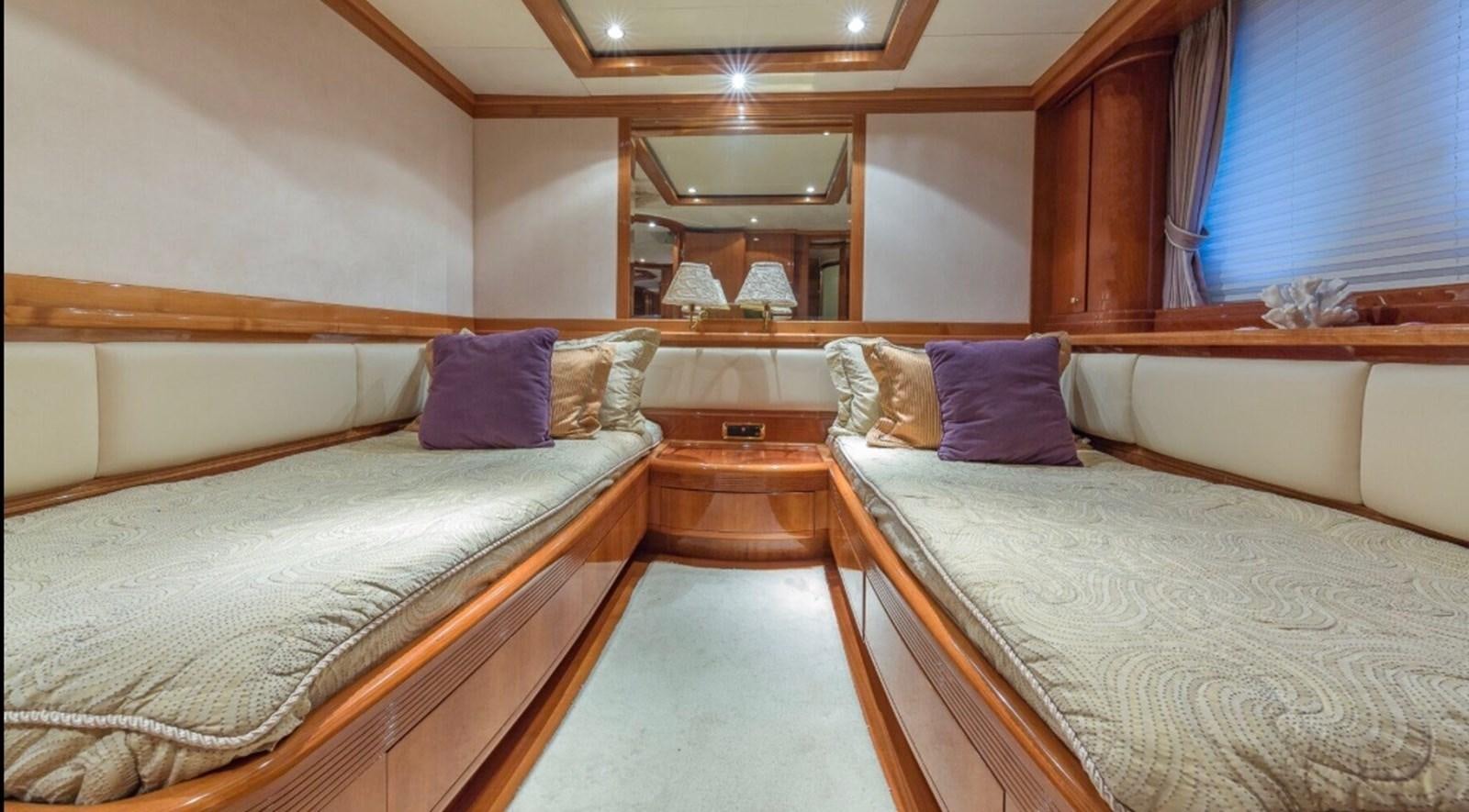 a room with two beds aboard AVA Yacht for Sale