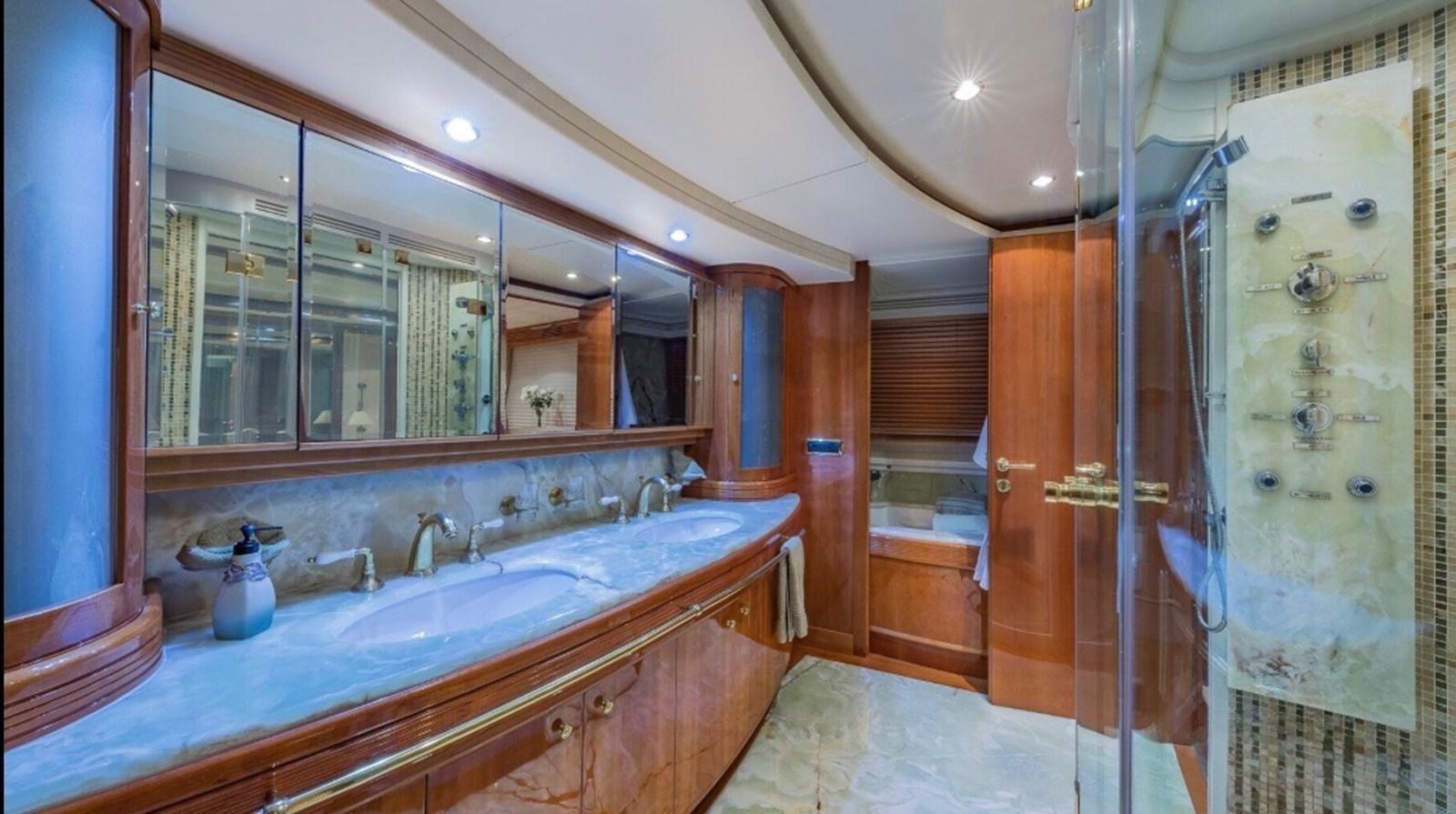 a bathroom with a large mirror aboard AVA Yacht for Sale