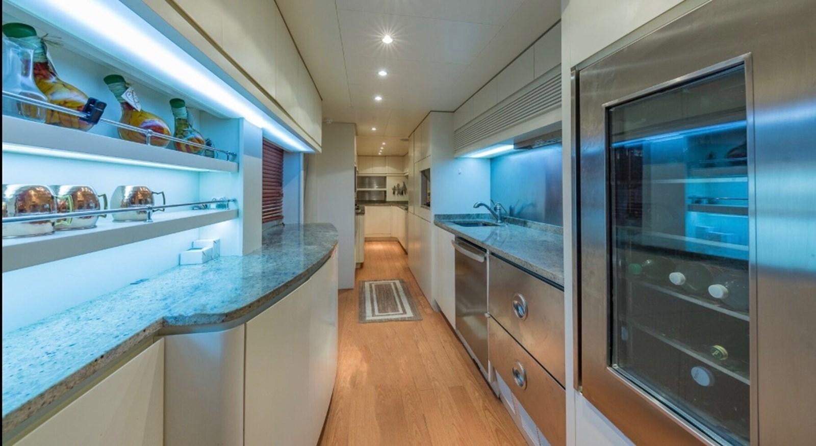 a kitchen with a glass door aboard AVA Yacht for Sale