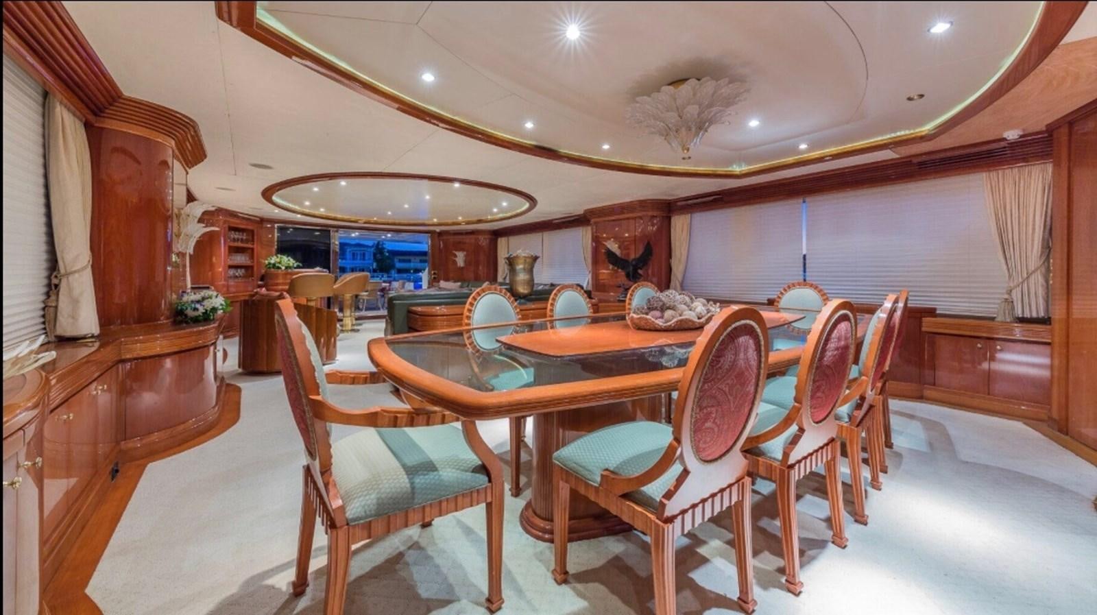a dining room with a table and chairs aboard AVA Yacht for Sale