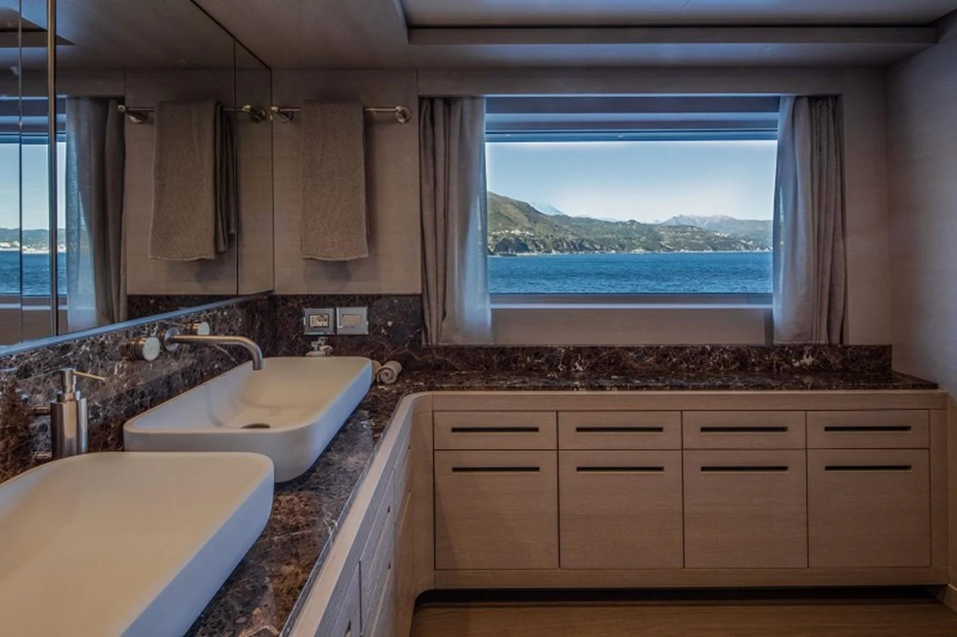 a bathroom with a large window aboard OTAM SD35 Yacht for Sale