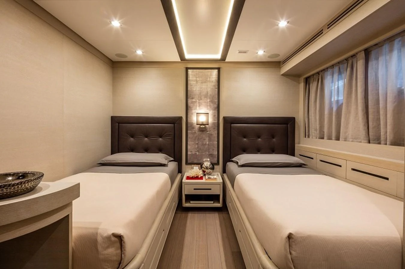 a room with three beds aboard OTAM SD35 Yacht for Sale